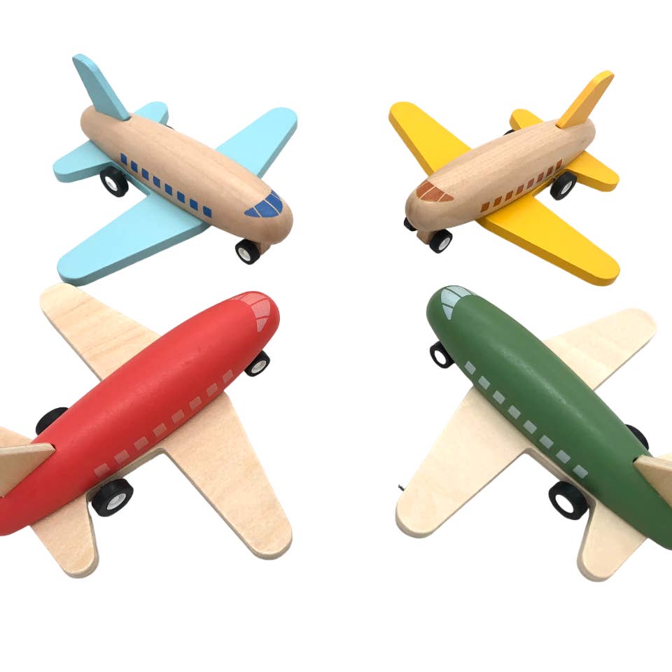 Four colorful wooden toy airplanes in various orientations on a white background.