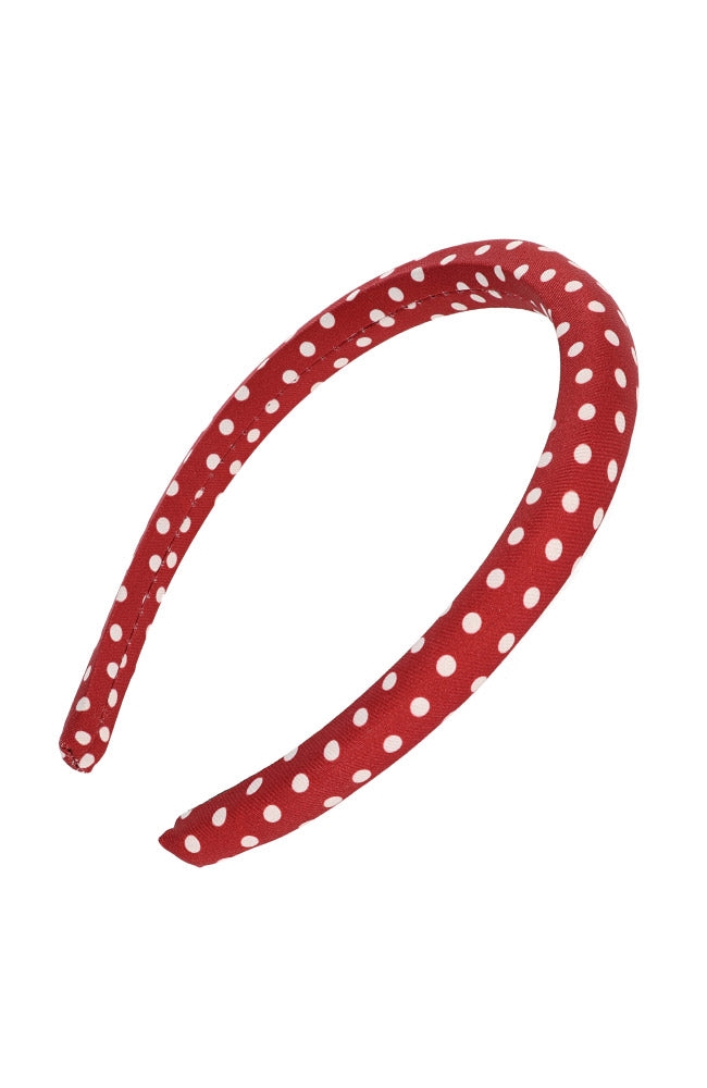 Red polka dot headband displayed on a white background.