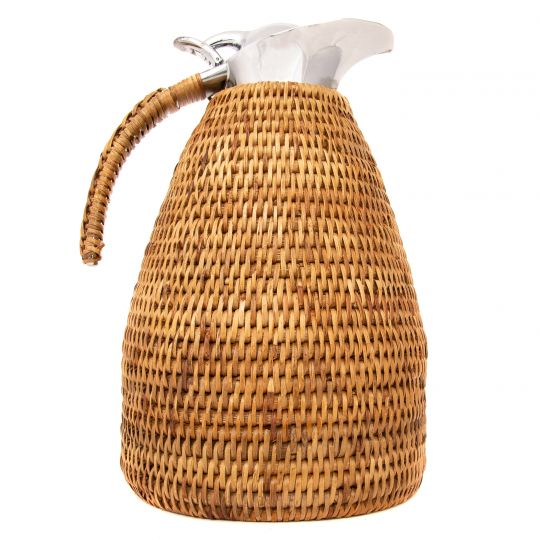 A woven pitcher with a silver spout and handle, designed for serving beverages.
