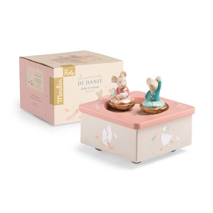 Musical box featuring two dancing mice on a decorative base, with a pastel-colored packaging.