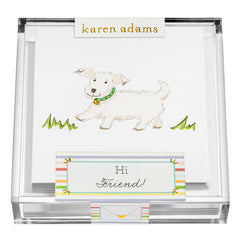 A white puppy with a green collar stands on grass, with a card that says "Hi Friend!" in a decorative box.