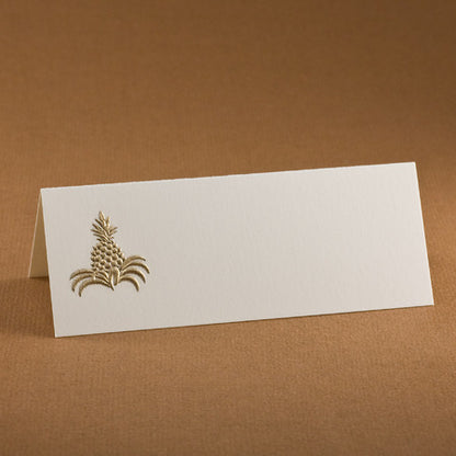 A blank card with a gold embossed pineapple design on the left side.
