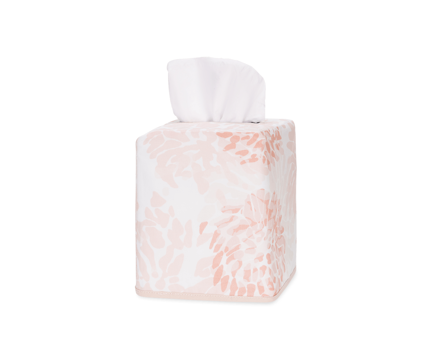 Tissue box with a floral design in soft pink tones, featuring tissues peeking out from the top.