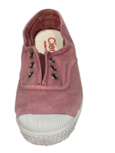 Pink Cienta laceless sneaker with white rubber sole and metal eyelets, facing forward.