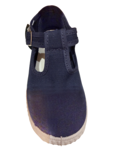 Navy T-strap sneaker with a textured upper and white sole, featuring a buckle closure.