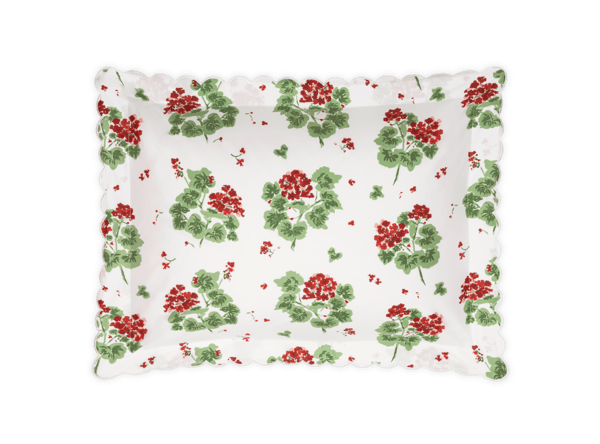 Rectangular tray with a floral pattern of red geraniums and green leaves on a white background. Scalloped edges.