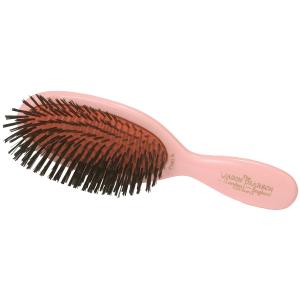 A pink hairbrush with a curved handle and black bristles.