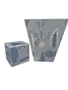 Two decorative containers with blue fish and shell patterns, one tall and triangular, the other small and square.