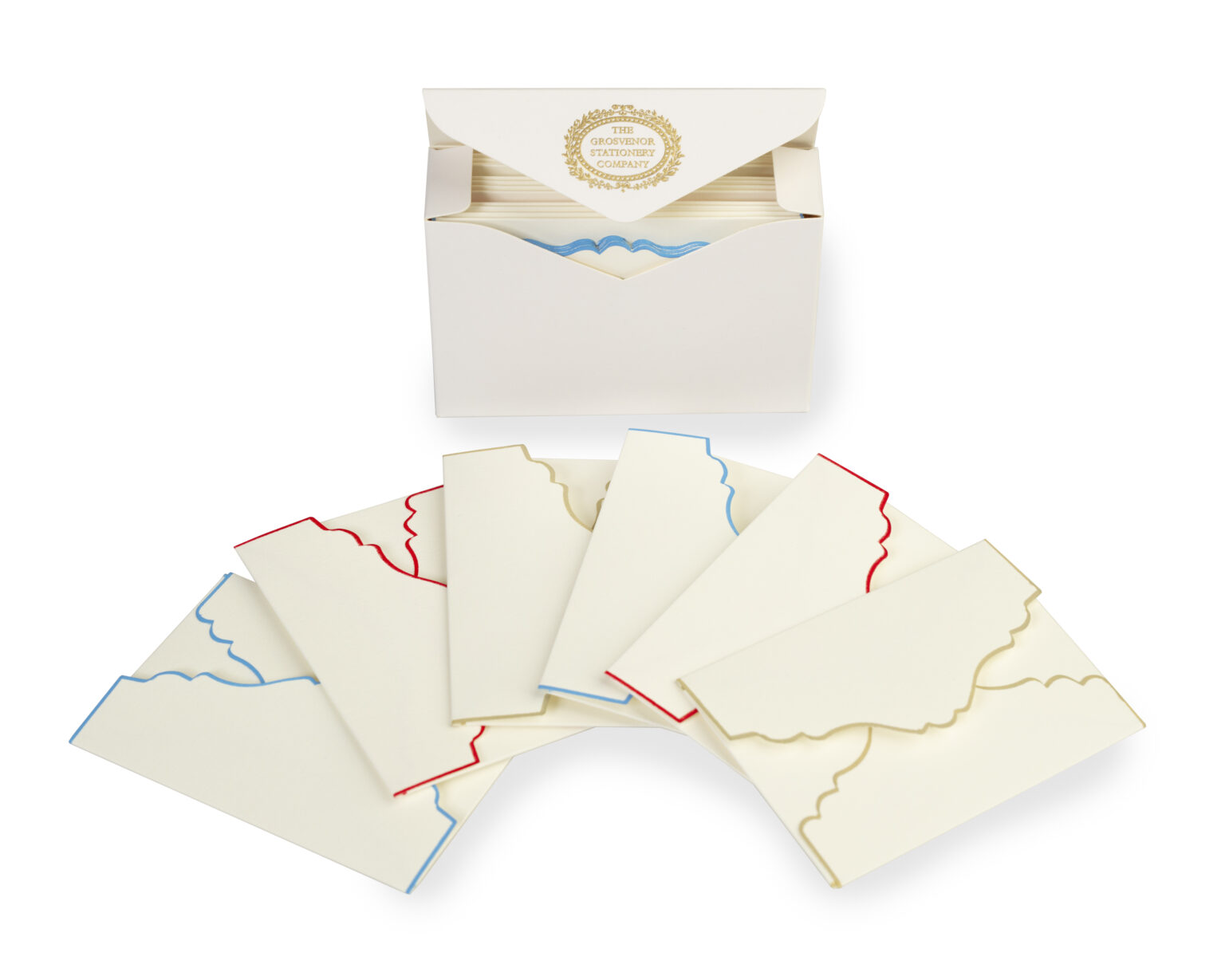 A box of decorative stationery with envelopes featuring scalloped edges in red and blue.