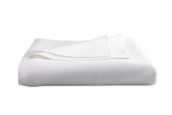 White tablecloth neatly folded, showcasing a smooth texture and clean appearance.