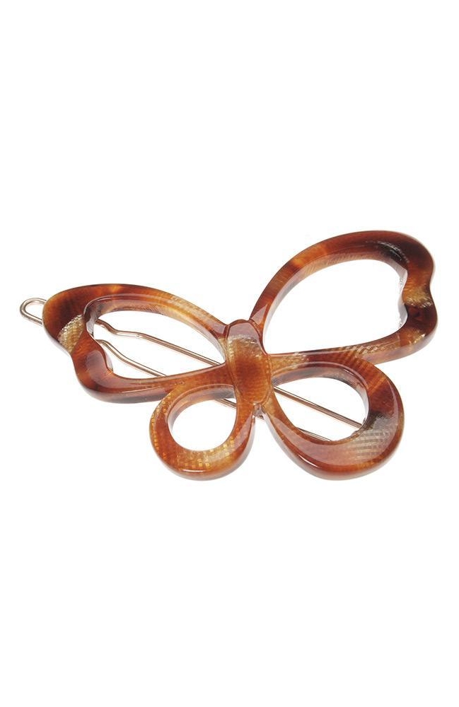 A brown butterfly-shaped hair clip with a metal clasp.